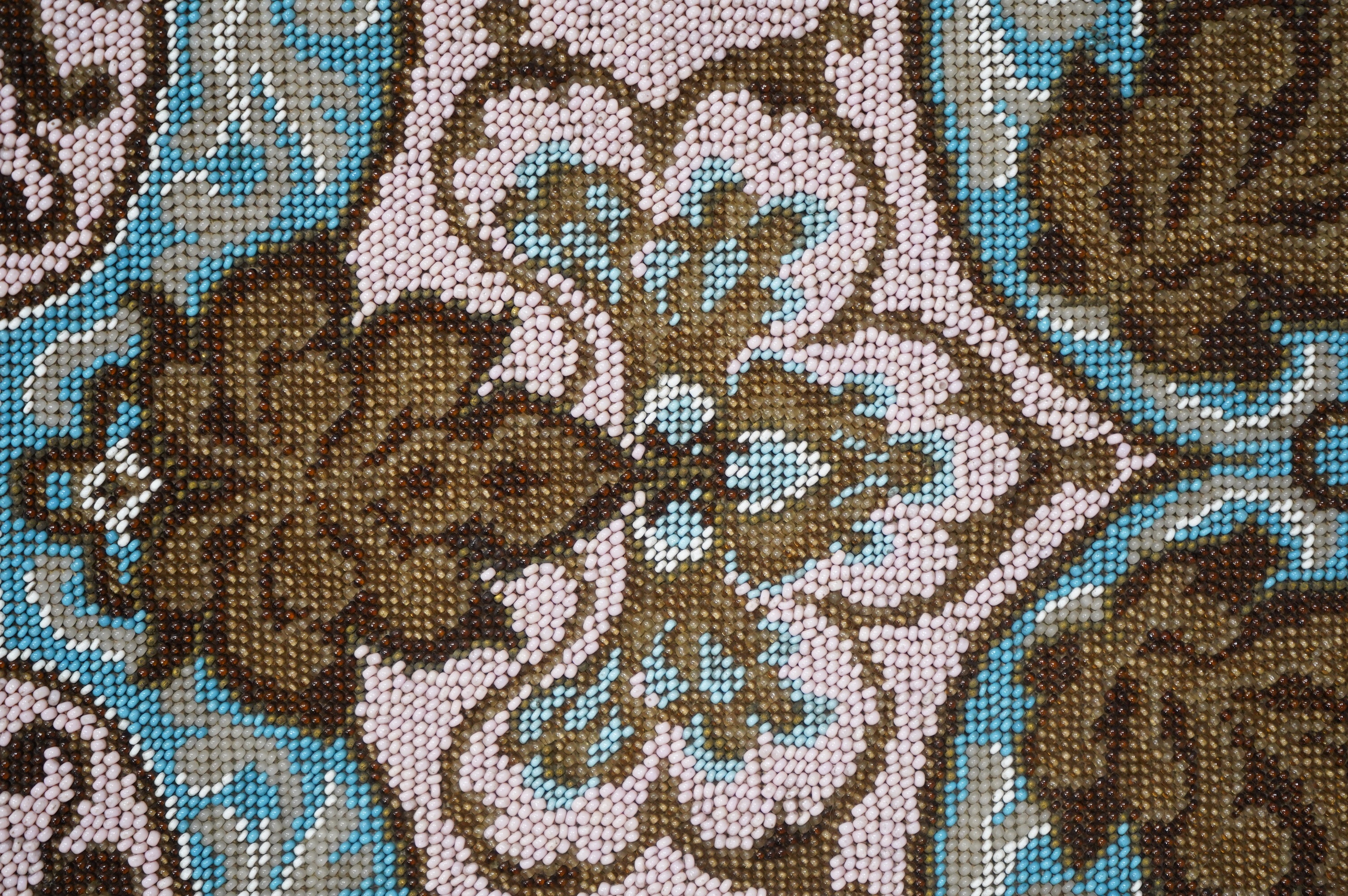 A 19th century unused Berlin beadwork tea cosy, worked in pink, turquoise, brown and white beads, beaded on two sides, the sides still joined. Ideal to convert as a cushion cover or two matching cushion covers, 55cm (tot